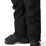 The 686 Women's SMARTY 3-in-1 Cargo Pant 2025 is black with zippered cargo pockets on both legs.