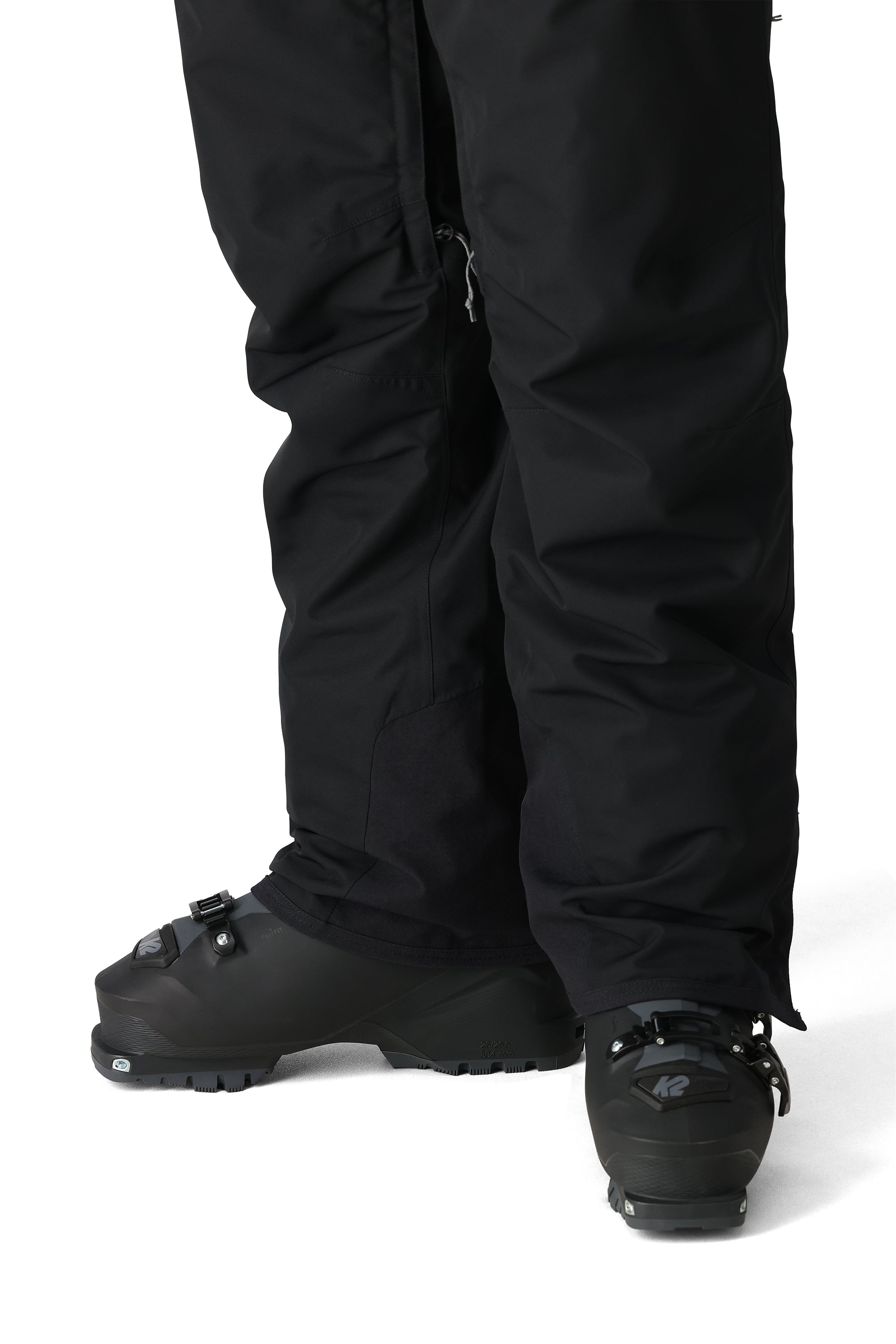 The 686 Women's SMARTY 3-in-1 Cargo Pant 2025 is black with zippered cargo pockets on both legs.