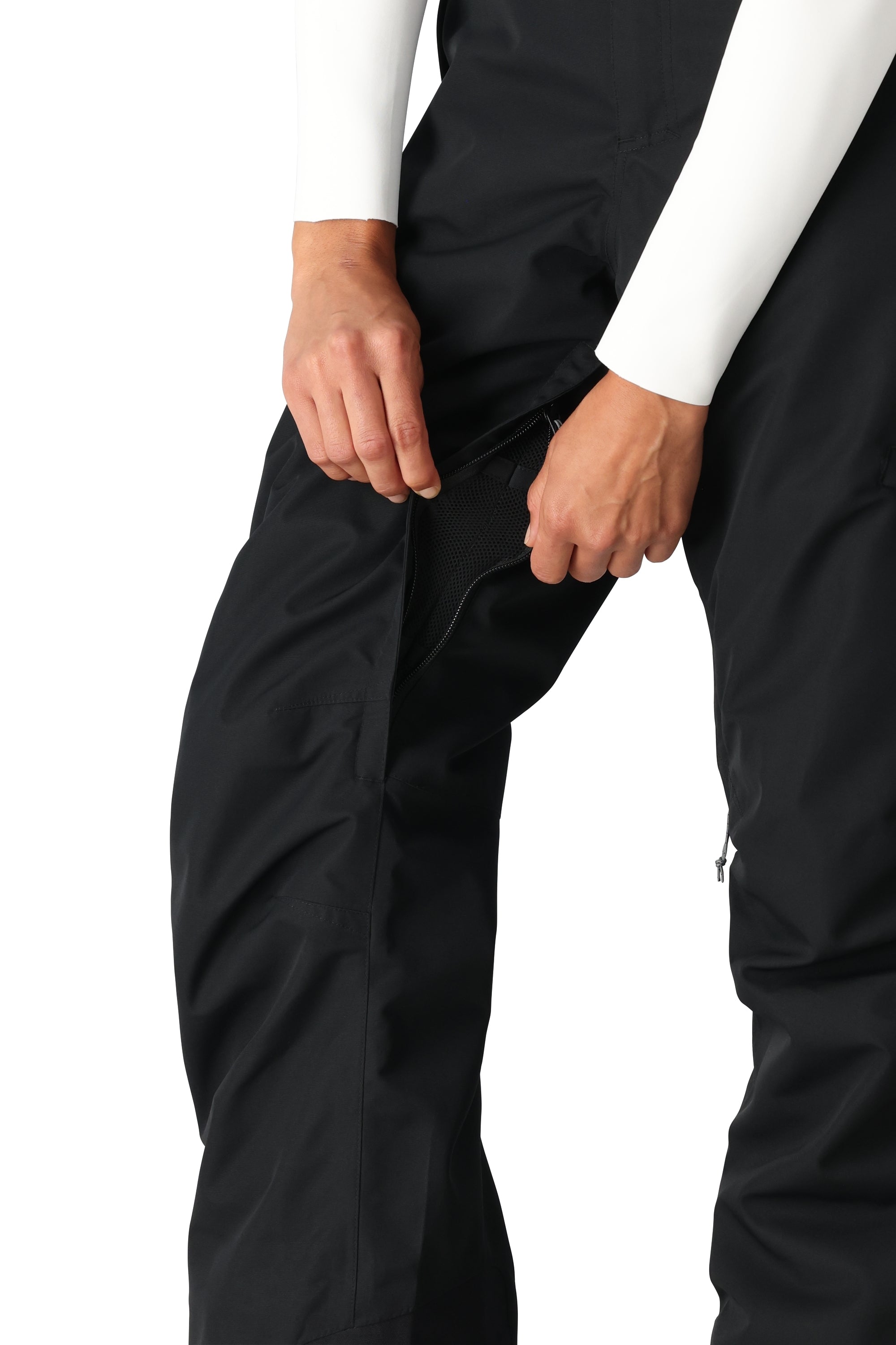 The 686 Women's SMARTY 3-in-1 Cargo Pant 2025 is a black pant with a zippered pocket on the side.