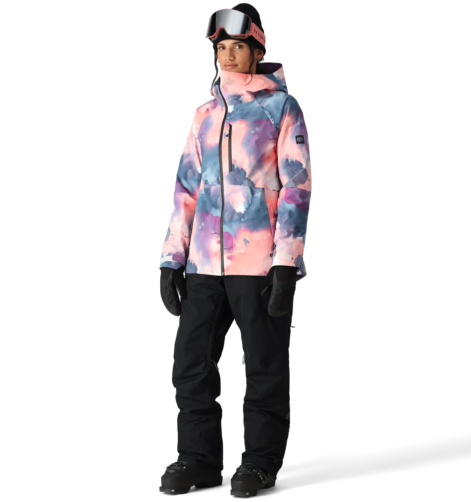 The 686 Women's SMARTY® 3-in-1 Cargo Pant has a pink and blue tie-dye pattern with black accents.