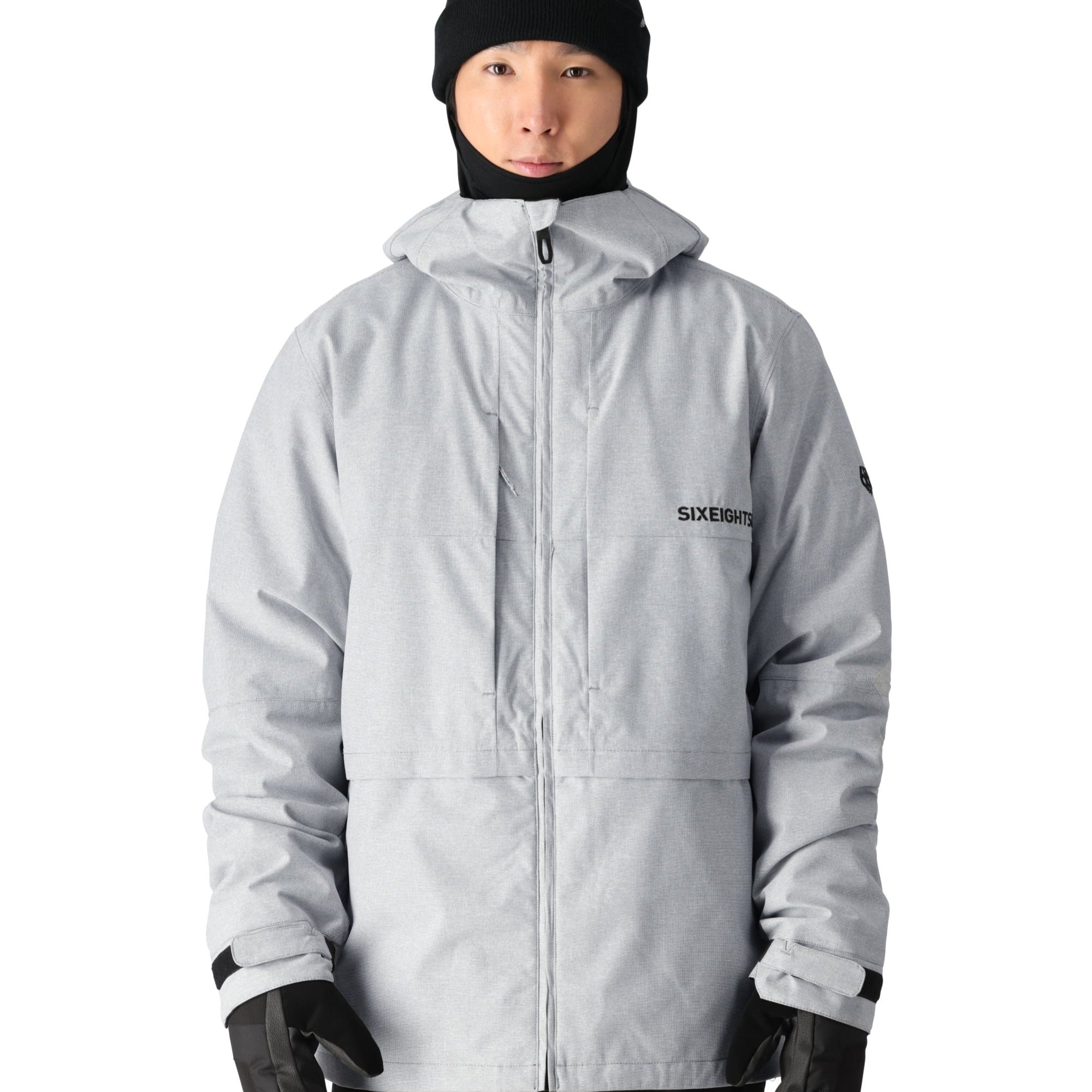 A light gray 686 Smarty 3-in-1 form jacket with a black hood and a zipper down the front.