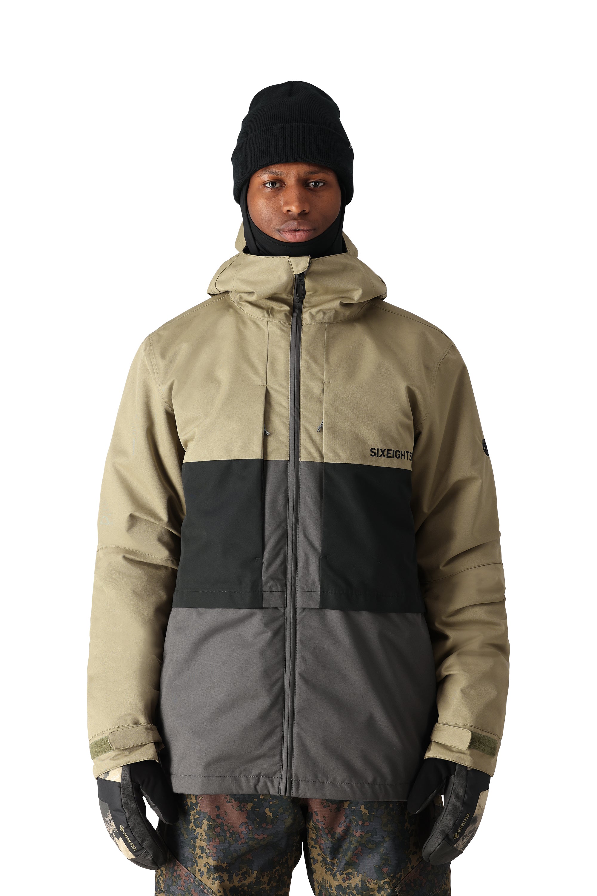 The 686 Smarty 3-in-1 Form Jacket in khaki and black has an insulated hood.