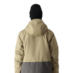 The 686 Smarty 3-in-1 Form Jacket in khaki and gray has an oversized zippered chest pocket on the front view.