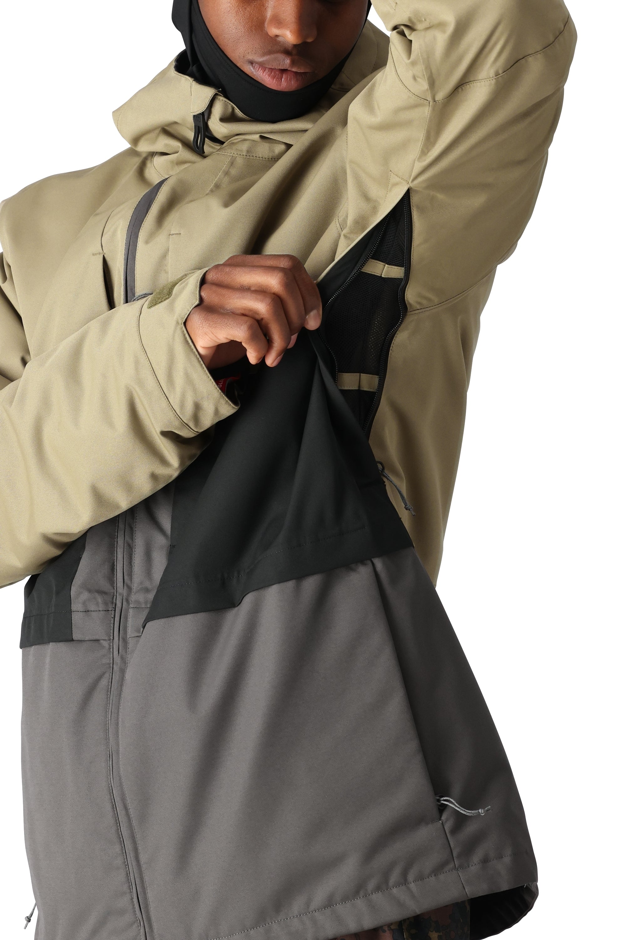 The 686 Smarty 3-in-1 Form Jacket features a tan and gray color scheme with an insulated hood.