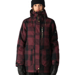 The 686 Women's Spirit Insulated Jacket 2025 is primarily maroon with black plaid and has an insulated hood.