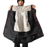 The 686 Spirit Insulated Jacket is predominantly black with brown accents and a white faux-fur trim.