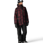 The 686 Women's Spirit Insulated Jacket 2025 is plum and black plaid with a high collar and zippered front.