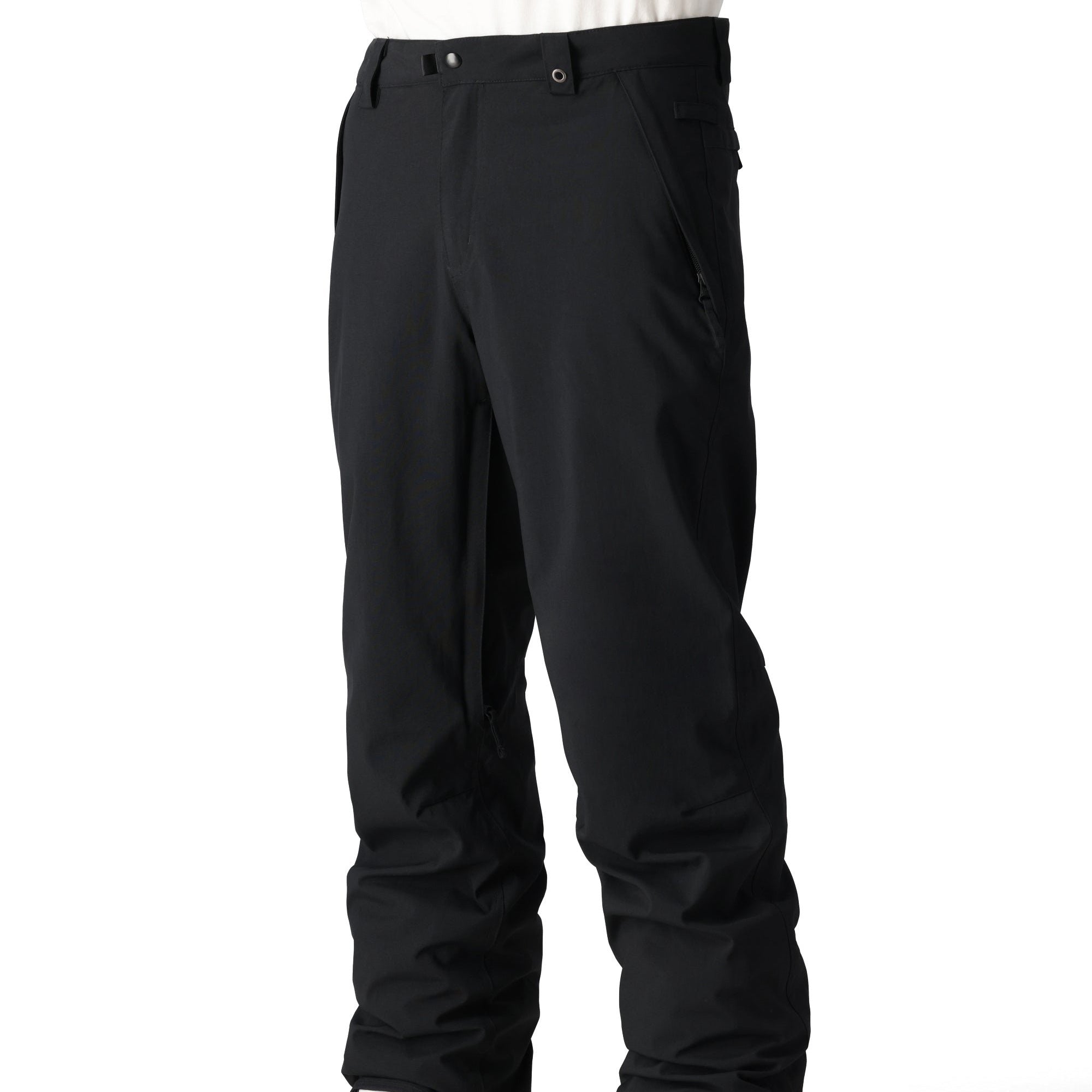 The 686 Men's Standard Shell Pant 2025 is black with a zippered pocket on the side and belt loops.