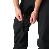 The 686 Men's Standard Shell Pant 2025 is black with a zippered leg opening and a breathable mesh lining.