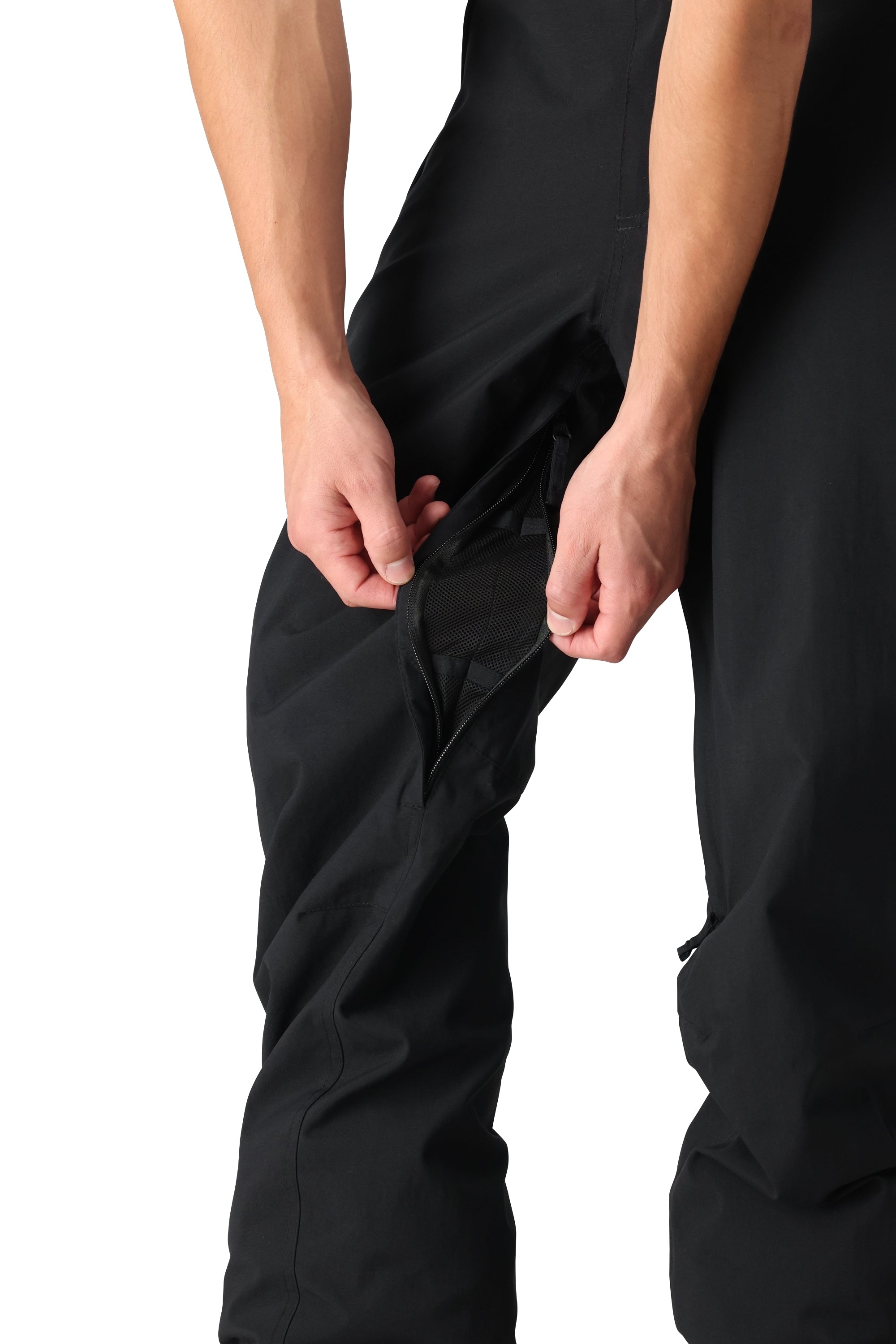 The 686 Men's Standard Shell Pant 2025 is black with a zippered leg opening and a breathable mesh lining.