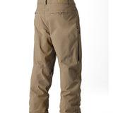 The 686 Men's Standard Shell Pant 2025 is shown in a light brown color with two zippered cargo pockets on each side.