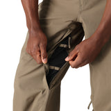 The 686 Men's Standard Shell Pant 2025 is primarily khaki with an insulated hood and zippered side pockets.