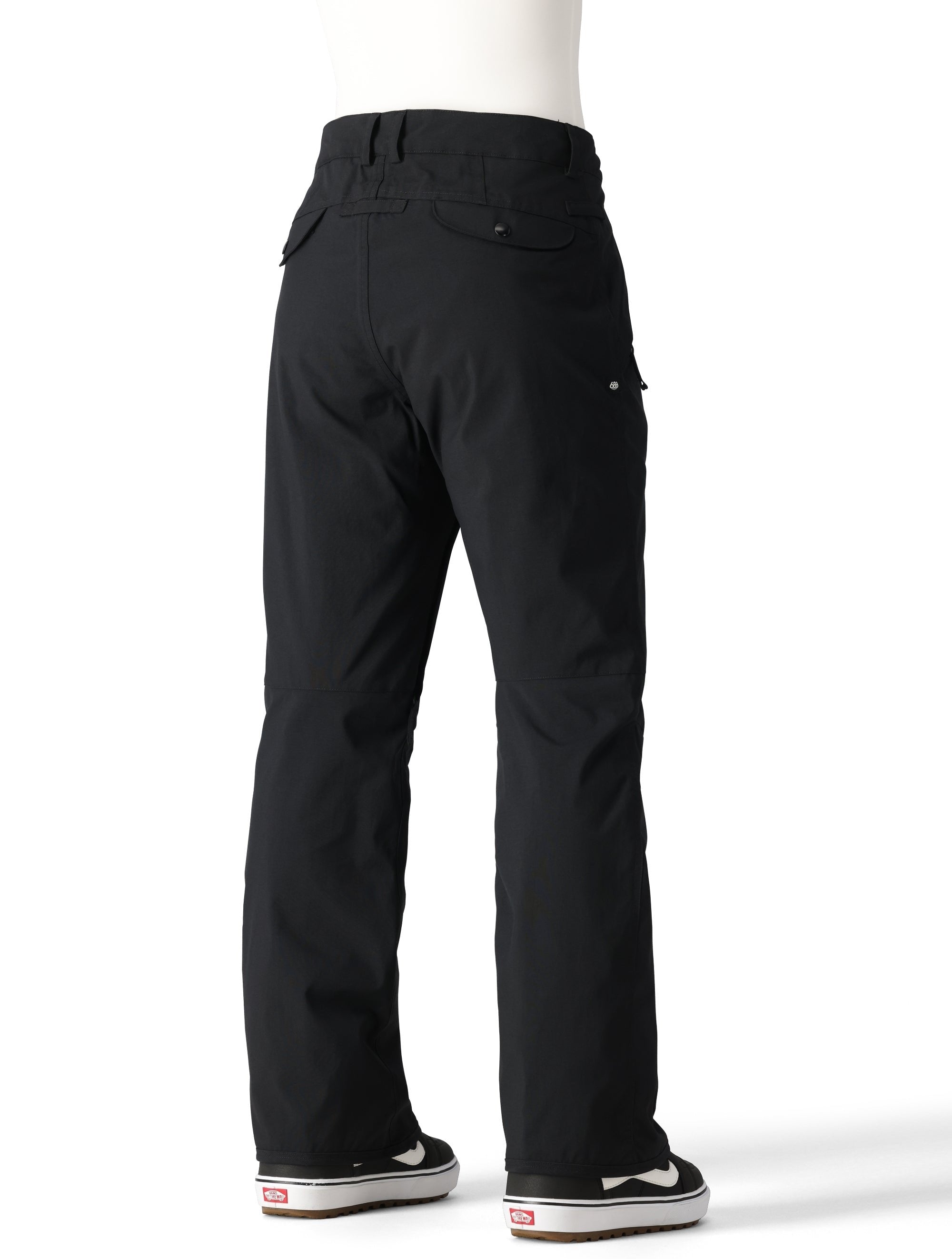 The 686 Women's Standard Shell Pant 2025 is black with two zippered front pockets and a snap button fly closure.