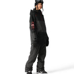 The 686 Women's Upton Insulated Anorak Jacket 2025 is black with red accents and a zippered front.