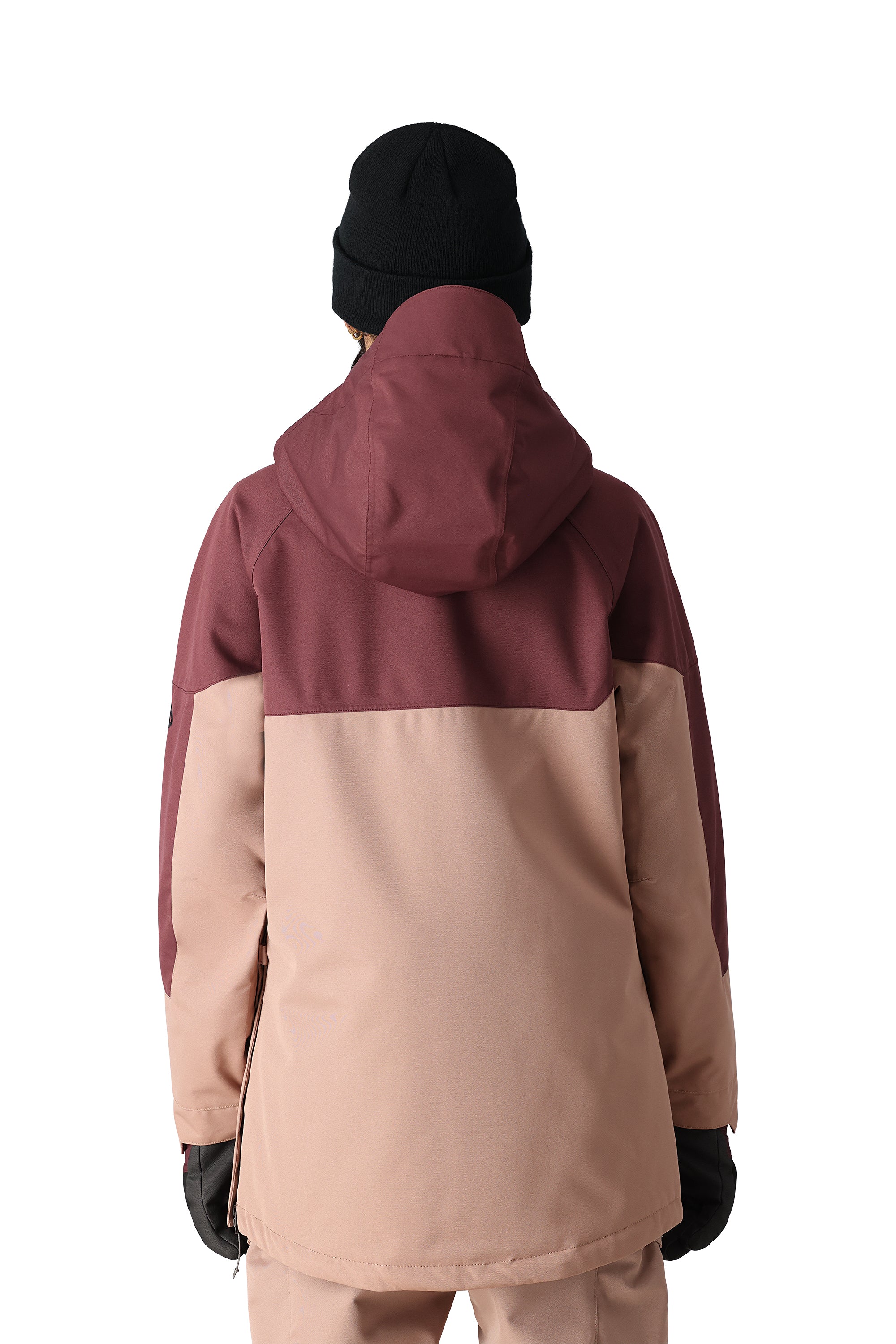 The 686 Women's Upton Insulated Anorak Jacket 2025 is primarily a muted pink jacket with a burgundy hood and black trim.