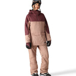 The 686 Upton Insulated Anorak Jacket 2025 is primarily in tan with maroon accents on the upper portion.