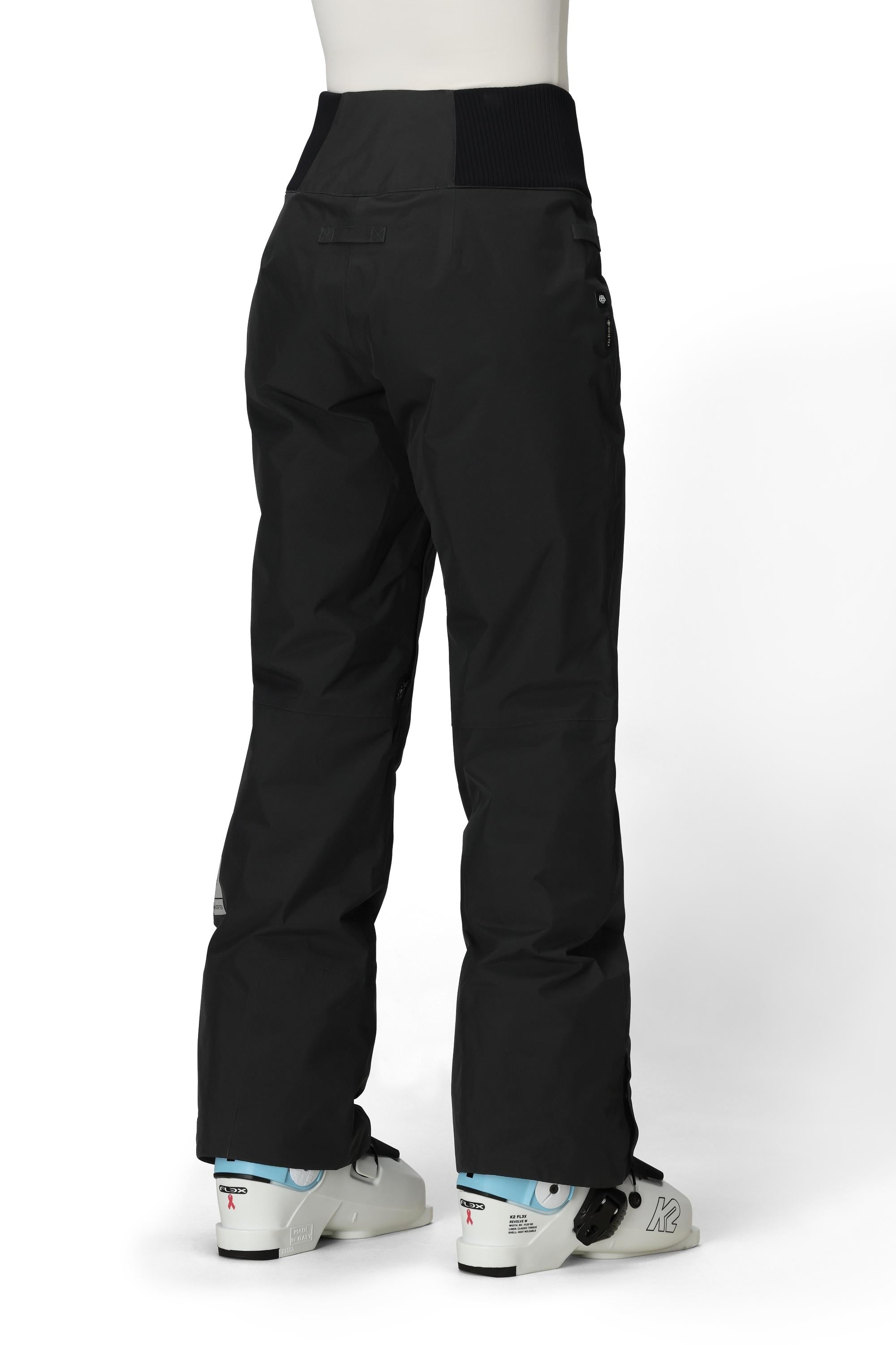 Black insulated ski pants with adjustable cuffs and zip pockets, straight leg