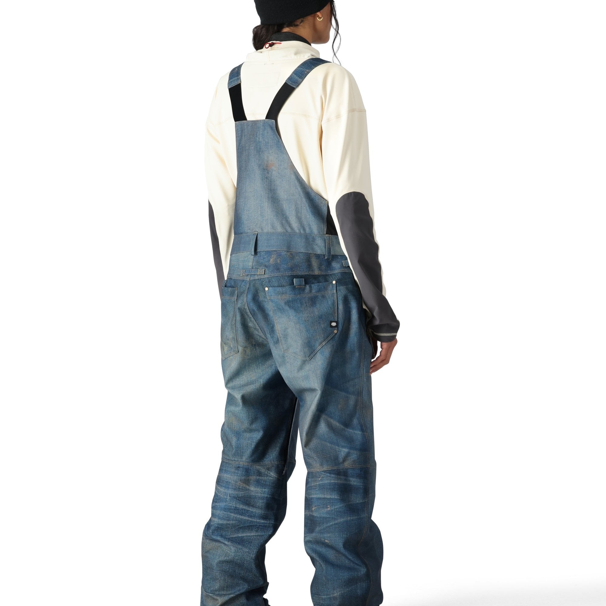 The 686 Women's Black Magic 20K Shell Bib 2025 is shown from the back in a black color with adjustable straps and belt loops.