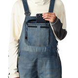 The 686 Women's Black Magic 20K Shell Bib features a light-colored shell with black trim and adjustable straps.