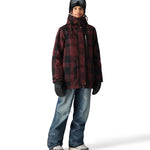 The 686 Black Magic 20K Shell Bib has a black and white checkered pattern on the front view.