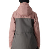 The 686 Women's Athena Insulated Jacket 2025 has a pink and grey color scheme with a hood visible on this back view.