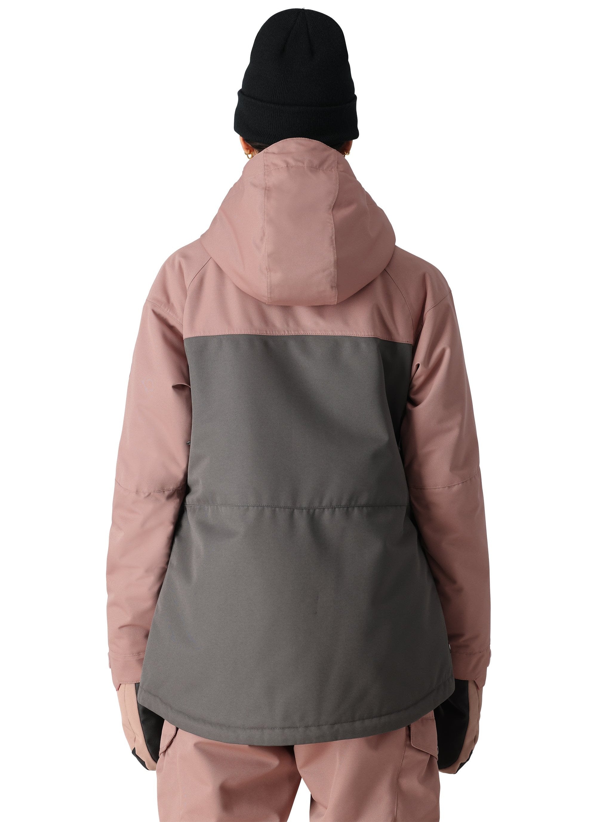 The 686 Women's Athena Insulated Jacket 2025 has a pink and grey color scheme with a hood visible on this back view.