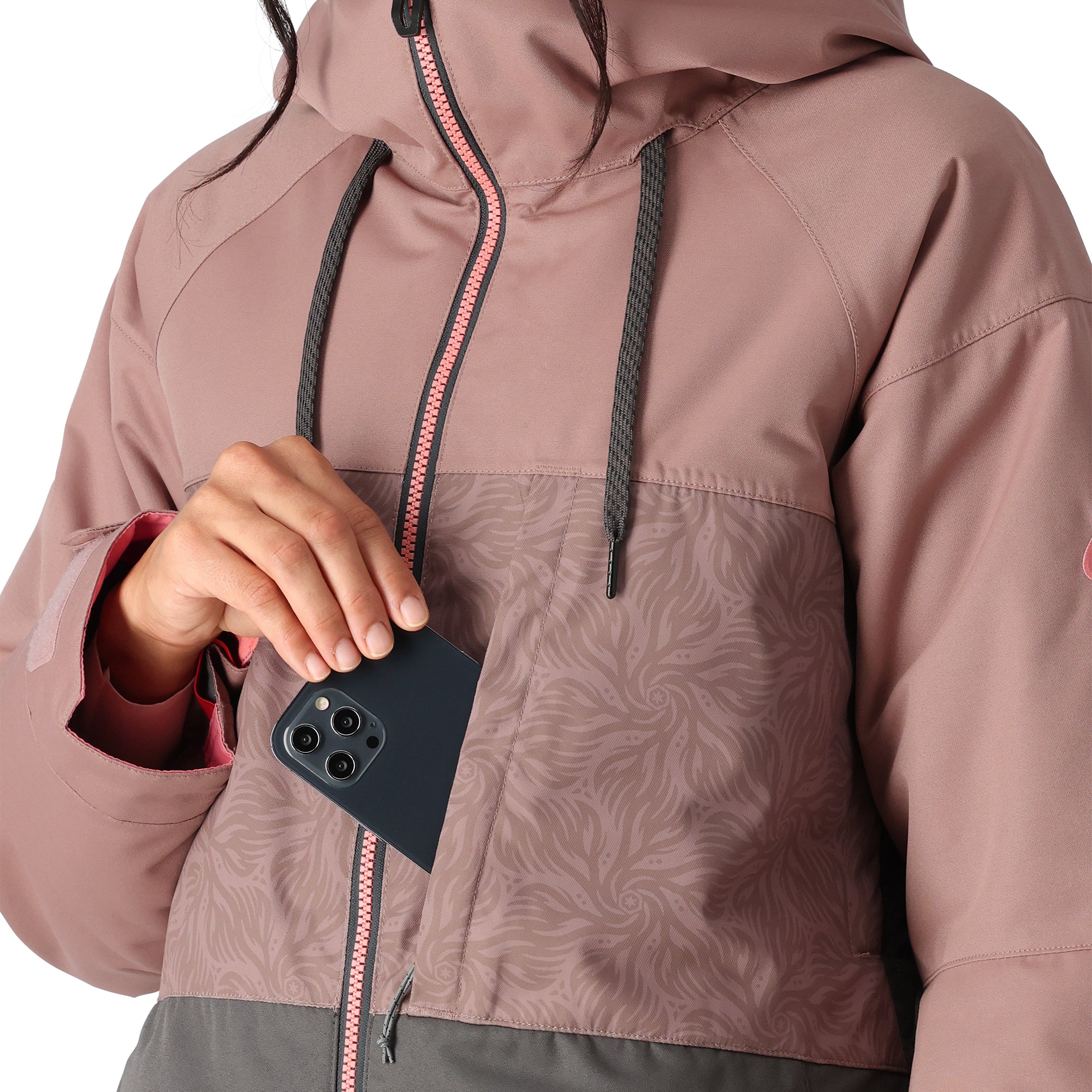 The 686 brand Athena insulated jacket has a pink top section with a swirling pattern and a gray bottom section.