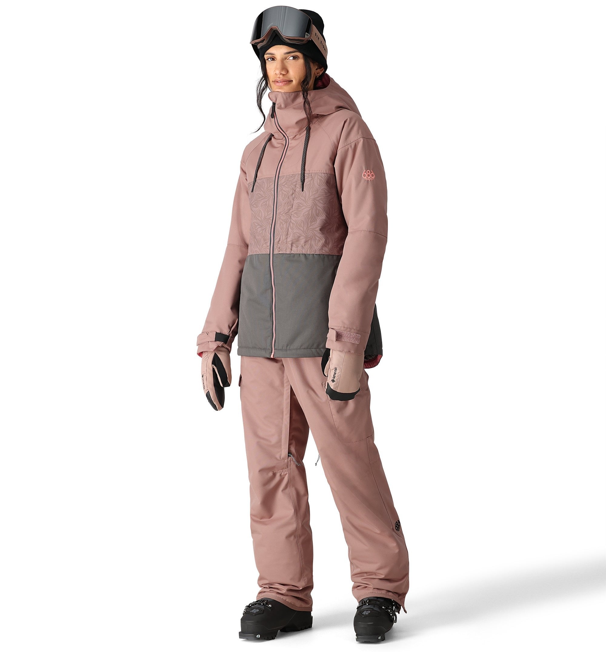 The 686 Women's Athena Insulated Jacket 2025 is primarily dusty rose with a gray panel at the waist.