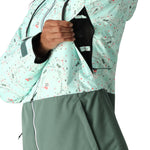 The 686 Women's Athena Insulated Jacket 2025 is primarily mint green with black and red accents.