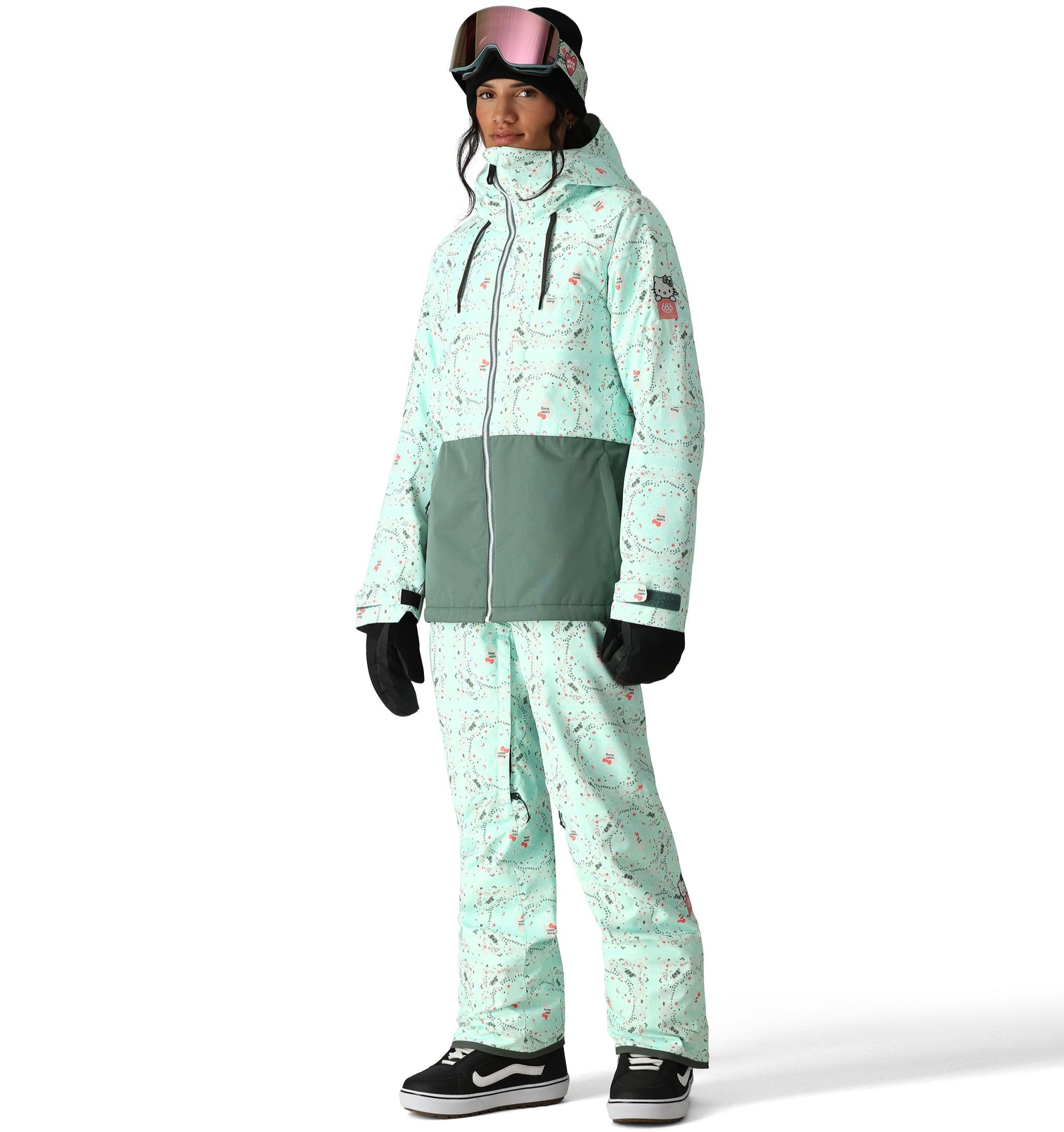 The 686 Women's Athena Insulated Jacket 2025 has a light green color with a pattern of small pink and gray snowflakes.