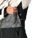 The 686 Women's Athena Insulated Jacket 2025 is primarily black and white with an abstract geometric pattern on the torso area.