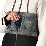 The 686 Women's Athena Insulated Jacket 2025 is predominantly black with a white upper section and a geometric pattern overlay.