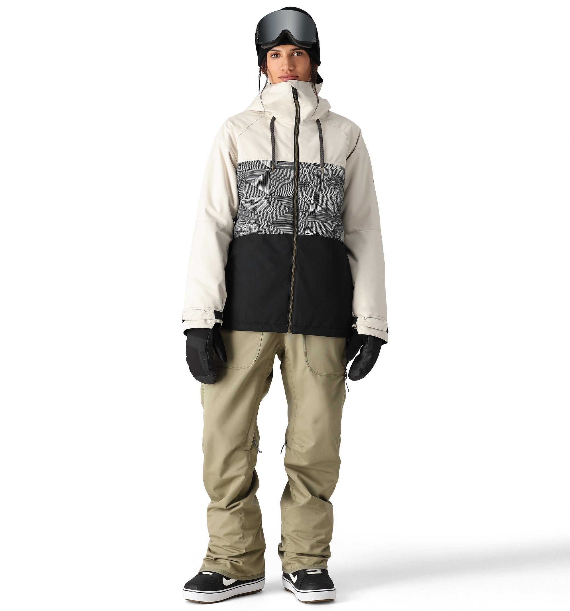 The 686 Women's Athena Insulated Jacket 2025 is primarily white with black accents and a geometric pattern on the upper chest area.