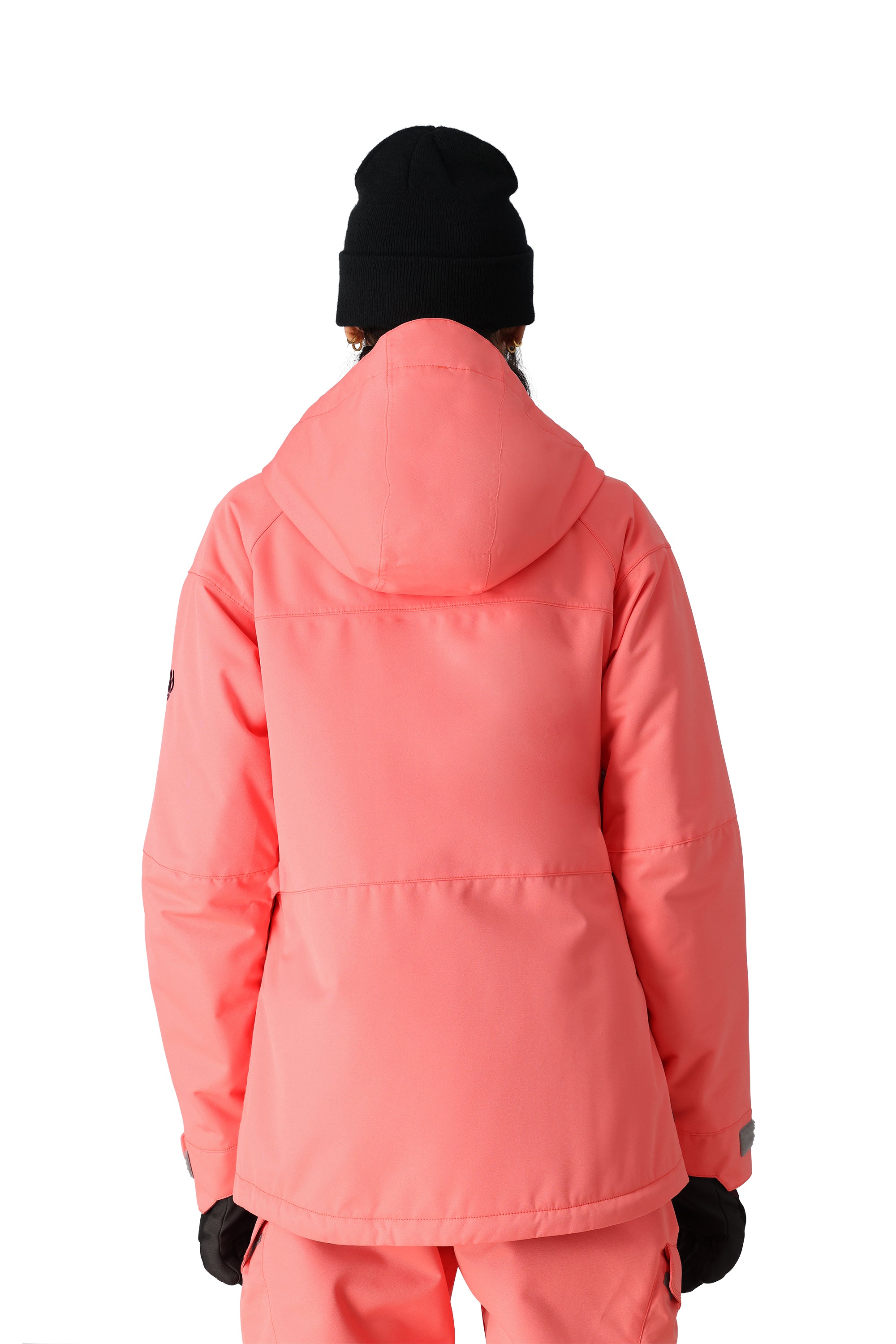 The 686 Women's Athena Insulated Jacket 2025 is showcased in a vibrant coral color with an insulated hood and zippered pockets.