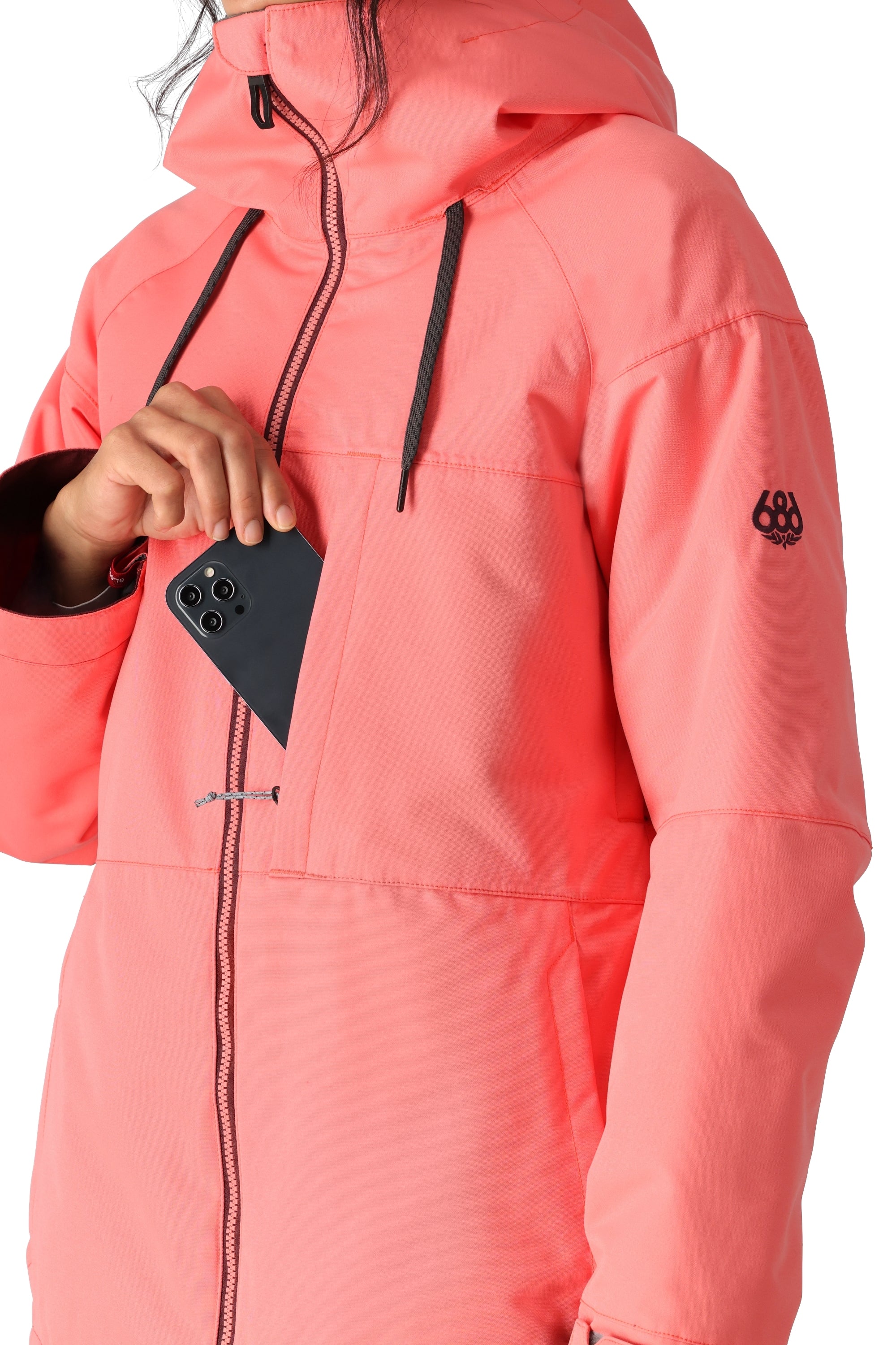 The 686 Women's Athena Insulated Jacket 2025 is depicted in salmon pink with an insulated hood and multiple zippered pockets.