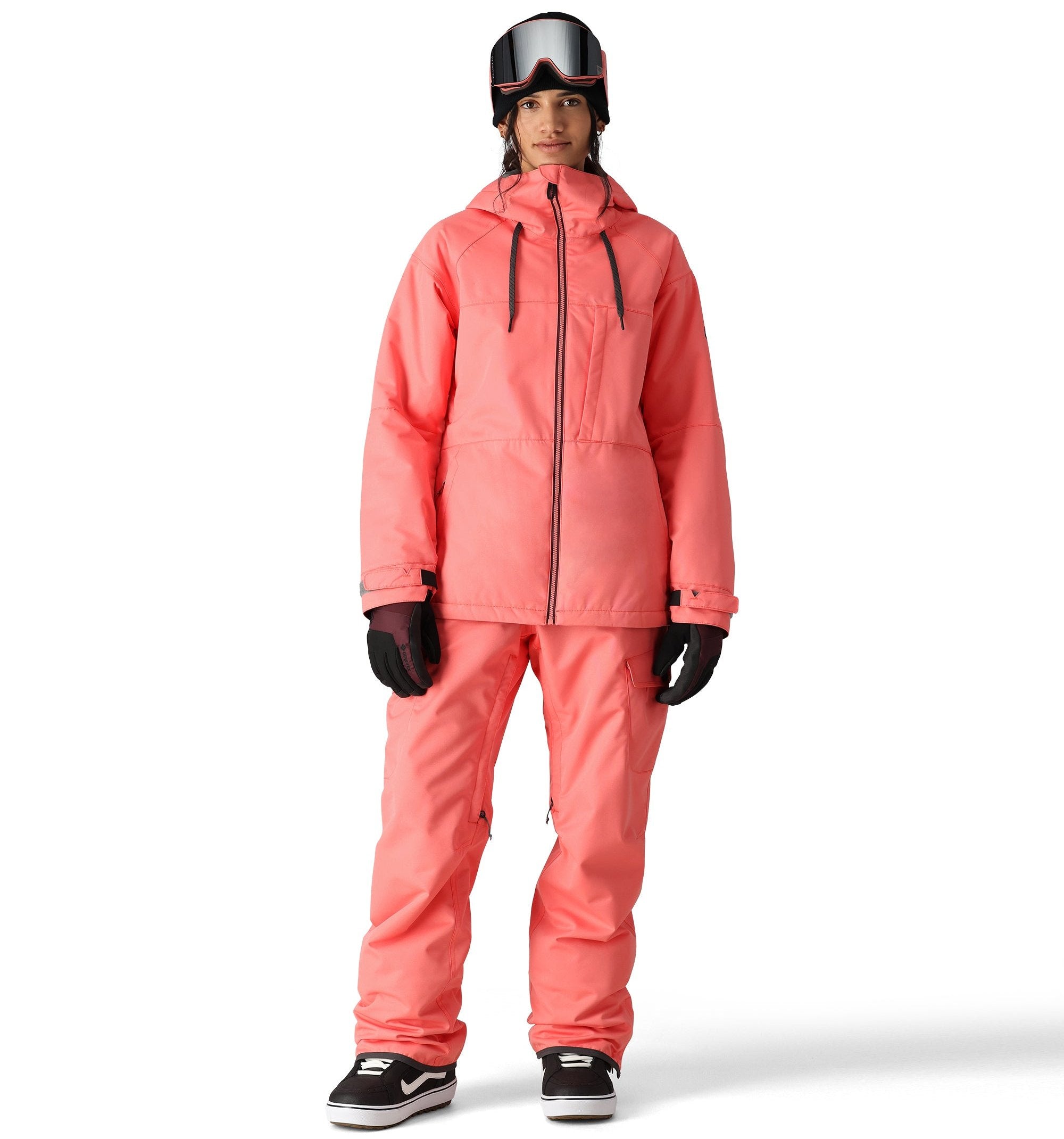 The 686 Women's Athena Insulated Jacket 2025 in coral pink has a high collar and a zippered chest pocket.