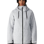 The 686 Women's Athena Insulated Jacket 2025 is primarily white with black speckles and has a black zipper down the front.