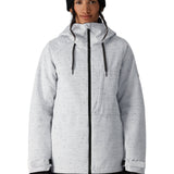 The 686 Women's Athena Insulated Jacket 2025 is primarily white with black speckles and has a black zipper down the front.