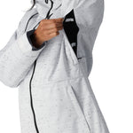 The 686 Women's Athena Insulated Jacket 2025 has a white and black speckled pattern with a black zipper running down the center.