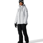 The 686 Women's Athena Insulated Jacket 2025 is predominantly white with black speckles and features a zippered front, drawstring hood, and thumbholes in black.