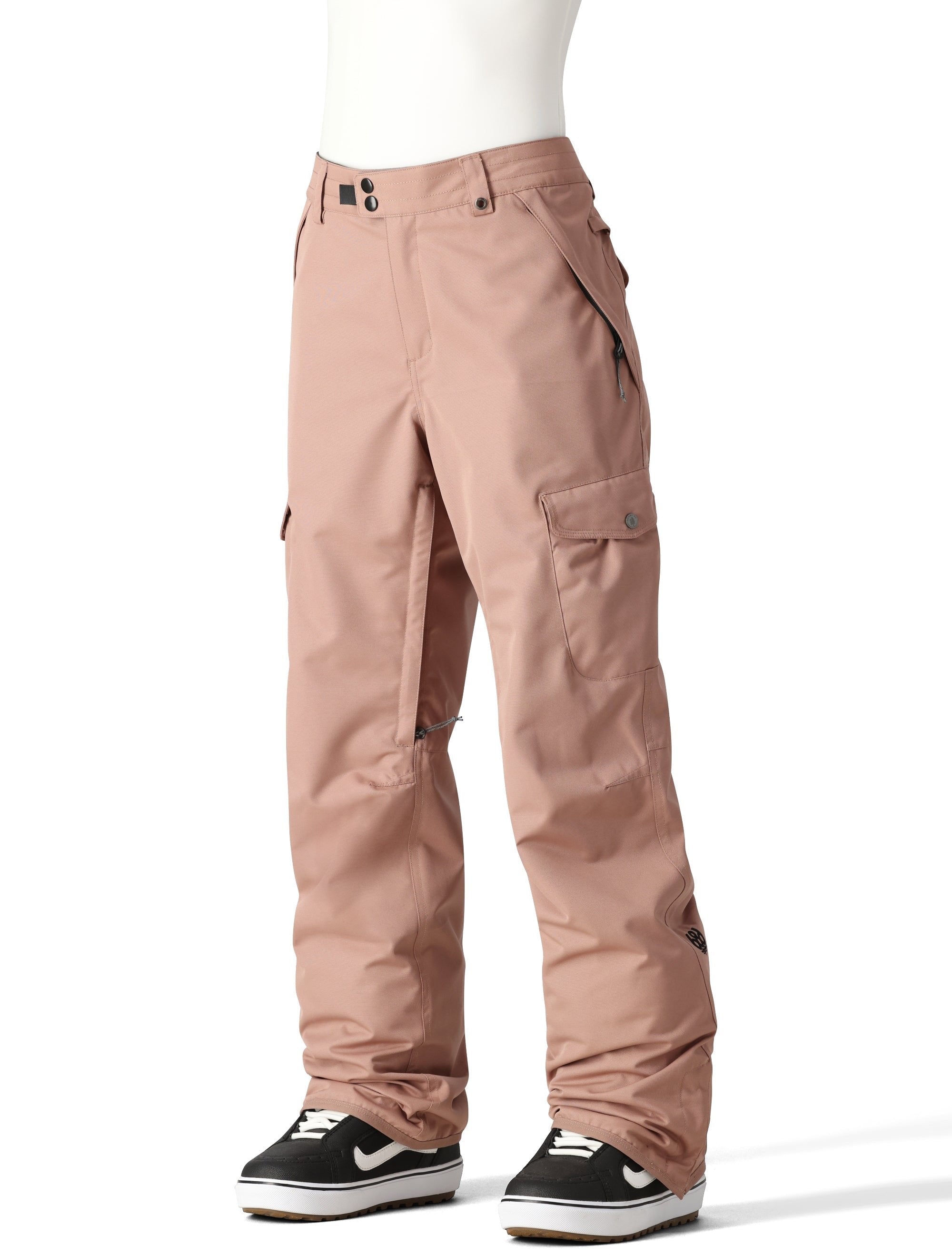 The 686 Women's Aura Insulated Cargo Pant 2025 is dusty rose with two zippered cargo pockets on each thigh.