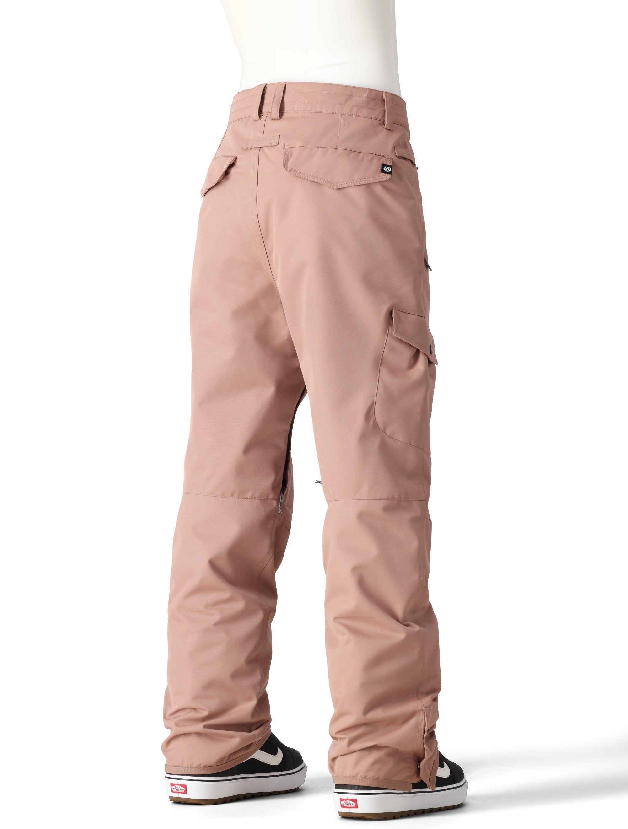 The 686 Women's Aura Insulated Cargo Pant 2025 is shown in rose-colored snow pants with cargo pockets on the thighs.