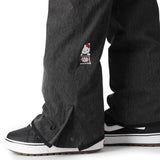 The 686 Women's Aura Insulated Cargo Pant 2025 is depicted in dark gray with a red and white logo on the thigh.