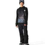 The 686 Women's Bonded Fleece Pullover Hoody features a black body with a blue and white abstract pattern on the front.