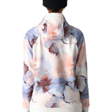 The 686 Women's Bonded Fleece Pullover Hoody 2025 is primarily white with a tie-dye pattern in shades of pink and blue.