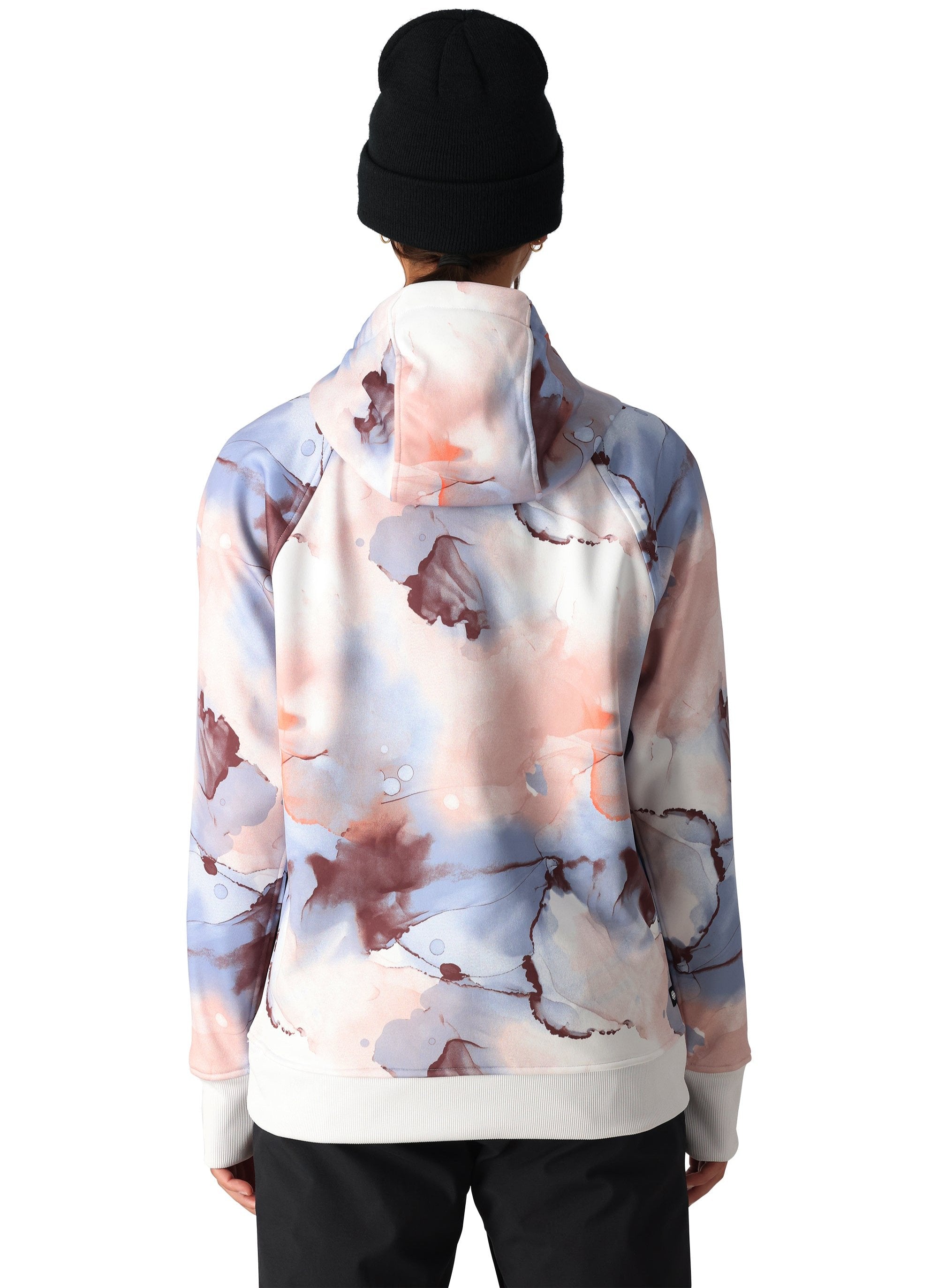 The 686 Women's Bonded Fleece Pullover Hoody 2025 is primarily white with a tie-dye pattern in shades of pink and blue.