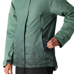 The 686 Women's Fantasia Insulated Jacket 2025 is depicted in a dark green color with a pattern on the lower portion and has a zippered chest pocket.