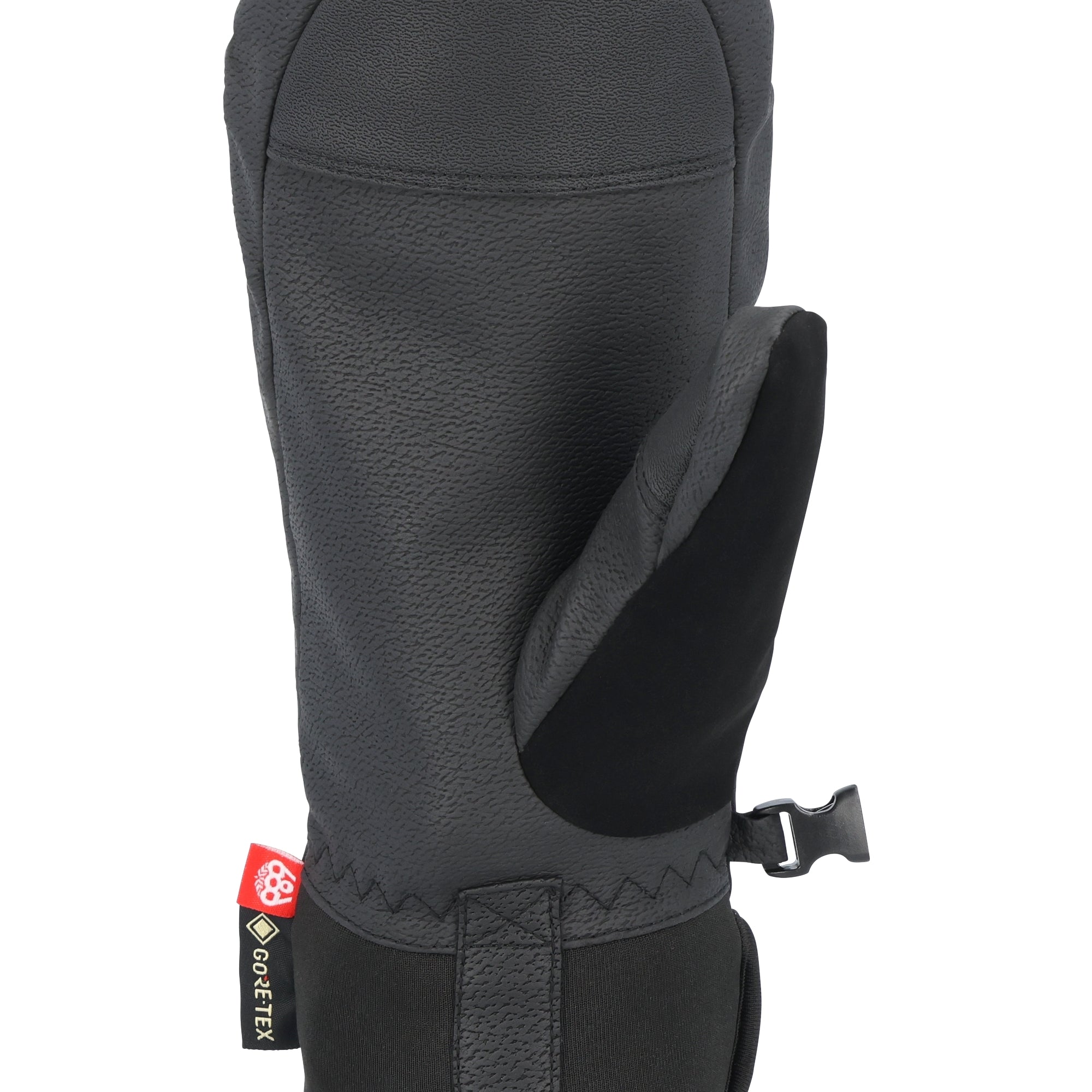 The 686 Women's GORE-TEX Linear Under Cuff Mitt 2025 is predominantly black with a red tag on the back side.