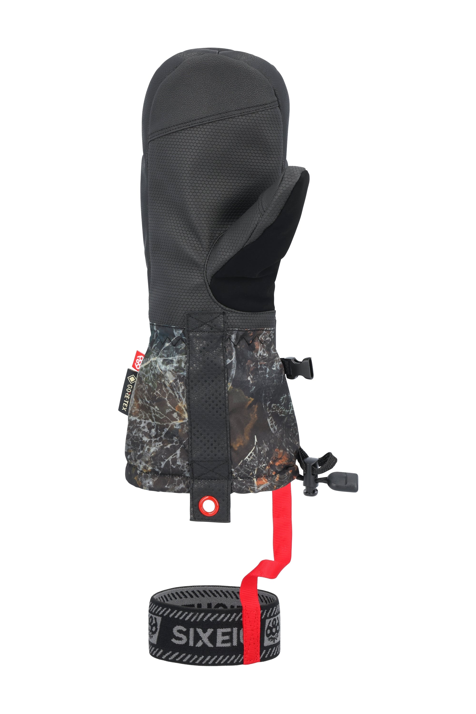 The 686 brand gauntlet mitt in this image features a black and gray camouflage pattern with an orange stripe down the back of the hand.