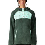 The 686 Women's Hemlock Sherpa Fleece Hoody 2025 is depicted in a dark green color with a light green patterned chest section.
